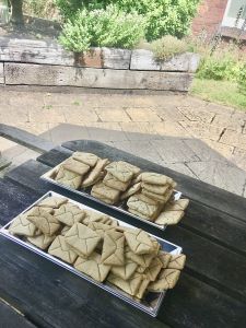 A picture of baked biscuits in the shape of letter biscuits